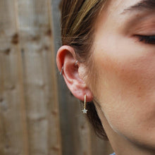 Load image into Gallery viewer, Star Drop Huggie Earrings In Gold
