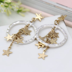 Worn Gold Star Cluster And Silver Hoop Earrings